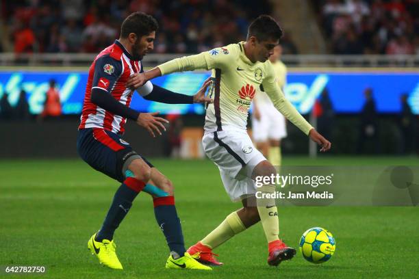 Jair Pereira of Chivas fights for the ball with Jose Daniel Guerrero of America during the 7th round match between Chivas and America as part of the...