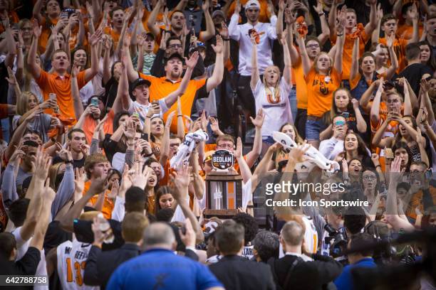 Oklahoma State Cowboys student fans celebrate with the Bedlam trophy after the Big 12 mens basketball game between the Oklahoma Sooners and the...