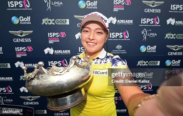 Ha Na Jang of South Korea imitates taking a selfie photo with her trophy after winning the Women's Australian Open during round four of the ISPS...