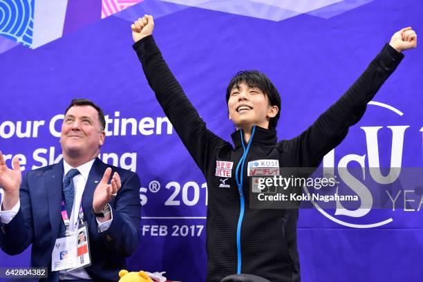 Yuzuru Hanyu of Japan celebrates with his coach Brian Orser at the podium in the men's free skating during ISU Four Continents Figure Skating...