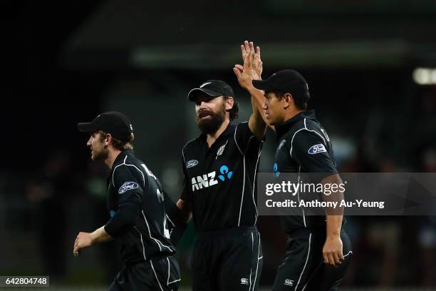 Ross Taylor of New Zealand celebrates with teammate Dean Brownlie for the wicket of Quinton de Kock of South Africa during the First One Day...