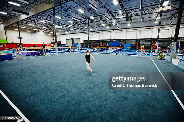 coach watching gymnast perform floor routine - daily sport girls bildbanksfoton och bilder