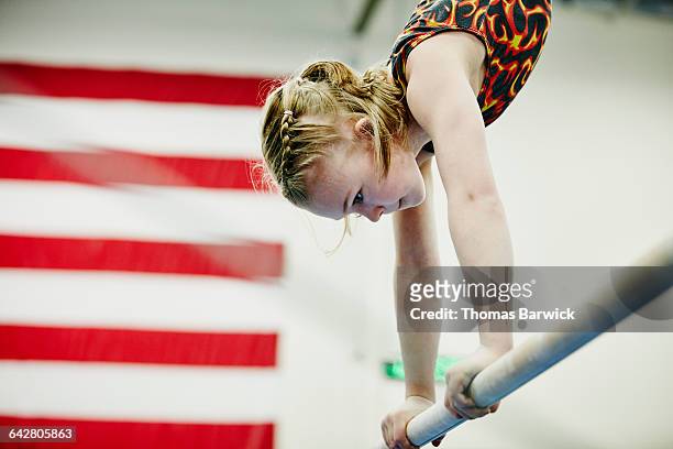 young female gymnast in handstand on bar - usa gymnastics photos et images de collection