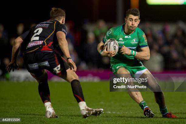 Tiernan O'Halloran of Connacht runs with the ball and Eliott Dee of Dragons during the Guinness PRO12 match between Connacht Rugby and Newport Gwent...