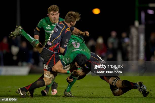 Ultan Dillane of Connacht tackled by Ollie Griffiths and Lewis Evans of Dragons during the Guinness PRO12 match between Connacht Rugby and Newport...