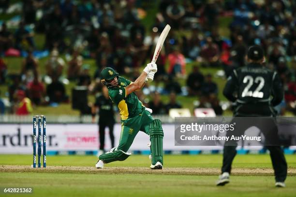 De Villiers of South Africa smashes a six to win the First One Day International match between New Zealand and South Africa at Seddon Park on...