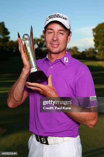 Brett Rumford of Australia poses with the trophy after winning the ISPS HANDA World Super 6 Perth at Lake Karrinyup Country Club on February 19, 2017...