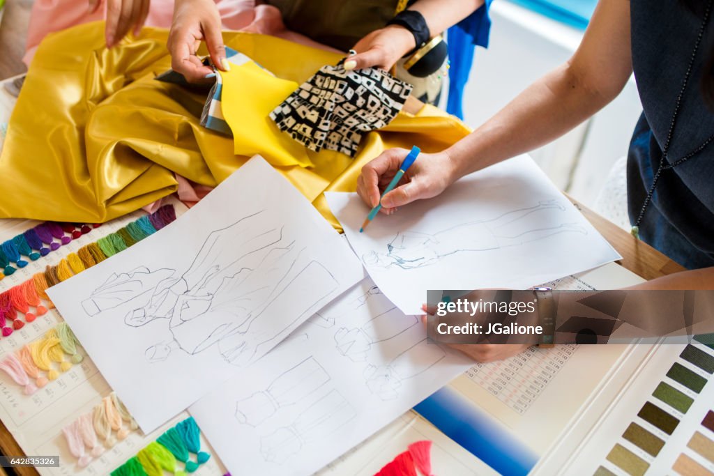 Overhead view of a team of fashion designers working