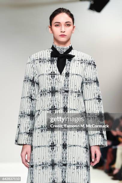 Model walks the runway at the Apu Jan show during the London Fashion Week February 2017 collections on February 19, 2017 in London, England.