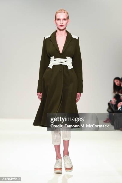 Model walks the runway at the Apu Jan show during the London Fashion Week February 2017 collections on February 19, 2017 in London, England.