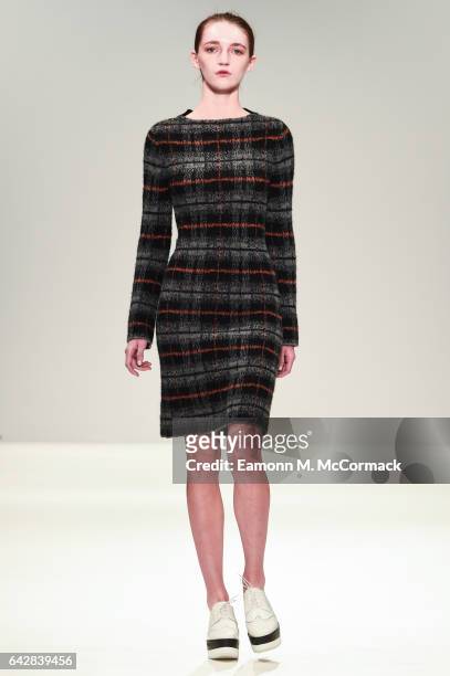 Model walks the runway at the Apu Jan show during the London Fashion Week February 2017 collections on February 19, 2017 in London, England.