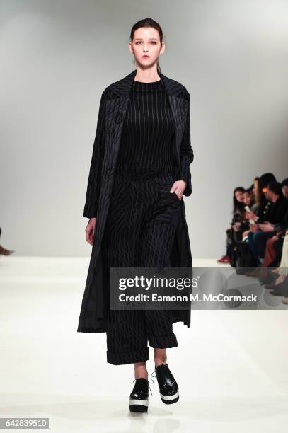 Model walks the runway at the Apu Jan show during the London Fashion Week February 2017 collections on February 19, 2017 in London, England.