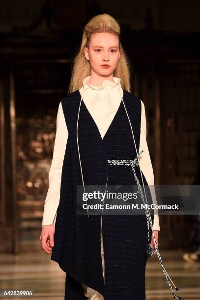 Model walks the runway at the Theo VII show during the London Fashion Week February 2017 collections on February 19, 2017 in London, England.