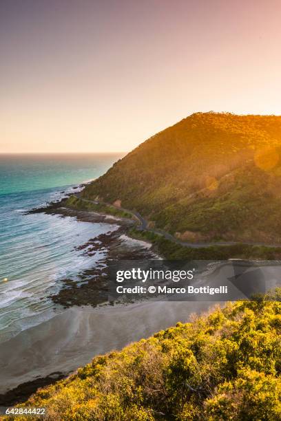 high angle view of the great ocean road at sunset. victoria, australia. - great ocean road stock pictures, royalty-free photos & images