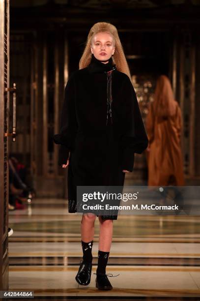 Model walks the runway at the Theo VII show during the London Fashion Week February 2017 collections on February 19, 2017 in London, England.