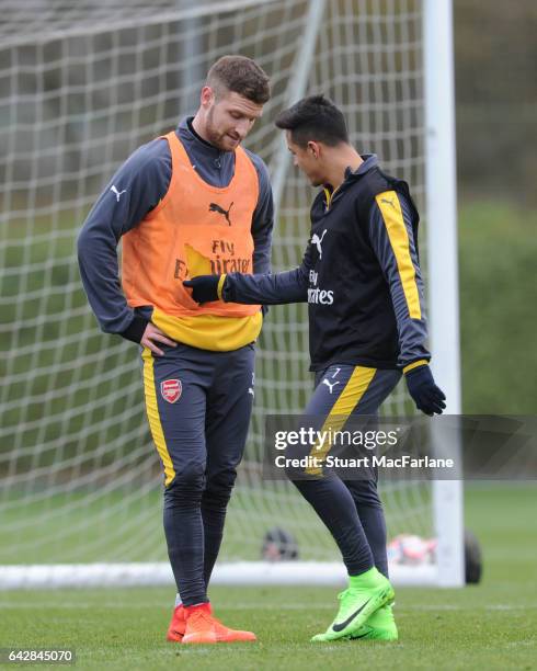 Shkodran Mustafi and Alexis Sanchez of Arsenal during a training session on February 19, 2017 in St Albans, England.