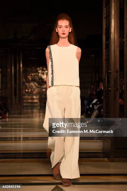 Model walks the runway at the Theo VII show during the London Fashion Week February 2017 collections on February 19, 2017 in London, England.