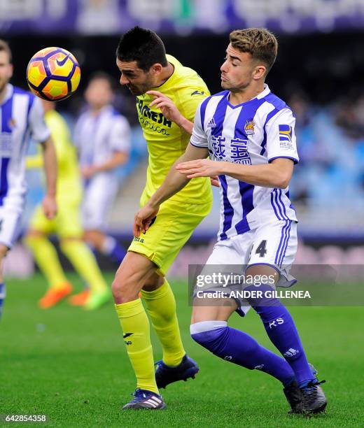 Villarreal's midfielder Bruno Soriano vies with Real Sociedad's midfielder David Concha during the Spanish league football match Real Sociedad vs...