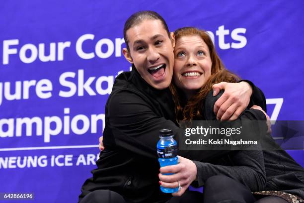 Jason Brown of United States celebrates with his coach Kori Abe at the kiss and cry after the men's free skating during ISU Four Continents Figure...