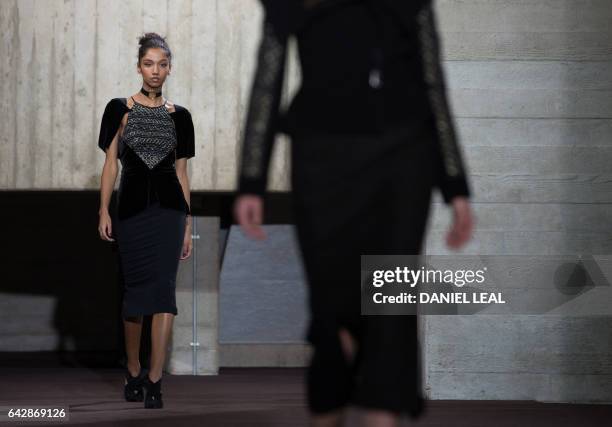 Models present creations during the catwalk show of France's Roland Mouret on the third day of the Autumn/Winter 2017 London Fashion Week at the...