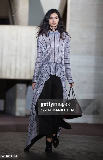 Models present creations during the catwalk show of France's Roland Mouret on the third day of the Autumn/Winter 2017 London Fashion Week at the...