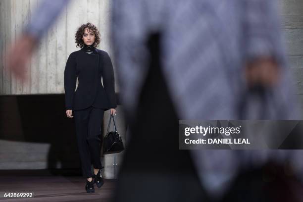 Models present creations during the catwalk show of France's Roland Mouret on the third day of the Autumn/Winter 2017 London Fashion Week at the...