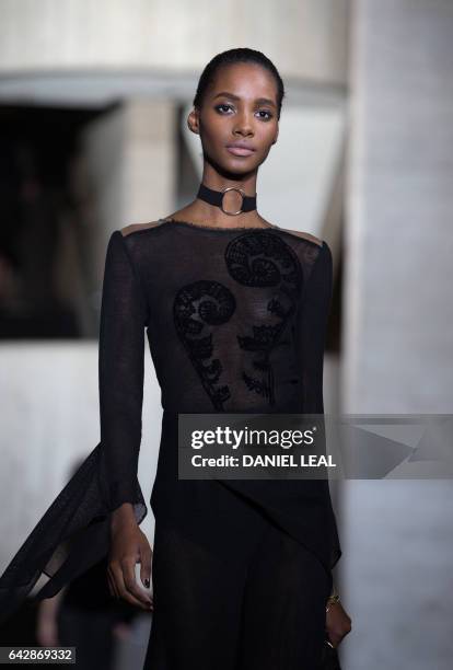 Models present creations during the catwalk show of France's Roland Mouret on the third day of the Autumn/Winter 2017 London Fashion Week at the...