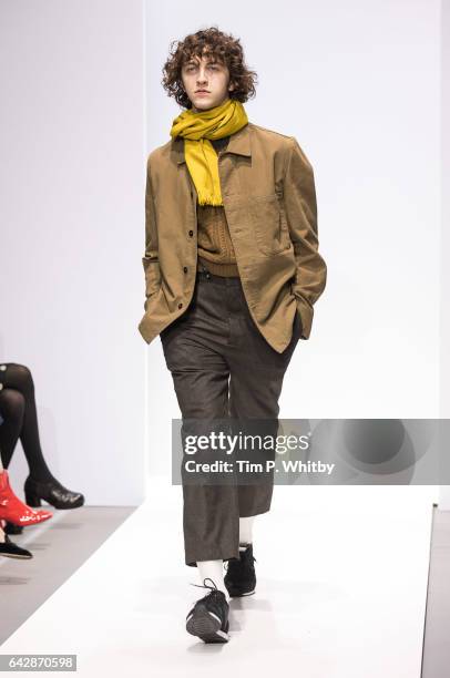 Model walks the runway at the Margaret Howell show during the London Fashion Week February 2017 collections at Rambert on February 19, 2017 in...