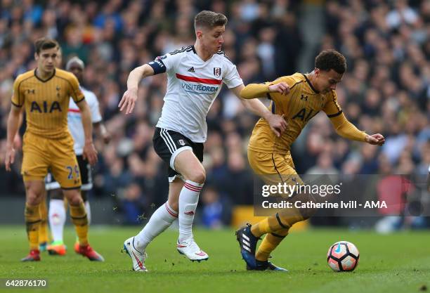 Tom Cairney of Fulham and Dele Alli of Tottenham Hotspur during The Emirates FA Cup Fifth Round match between Fulham and Tottenham Hotspur at Craven...