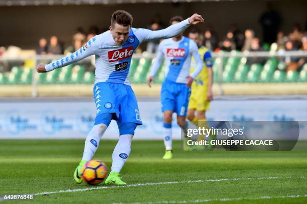 Napoli's midfielder from Poland Piotr Zielinski kicks and scores during the Italian Serie A football match Chievo vs Napoli at "Bentegodi Stadium" in...