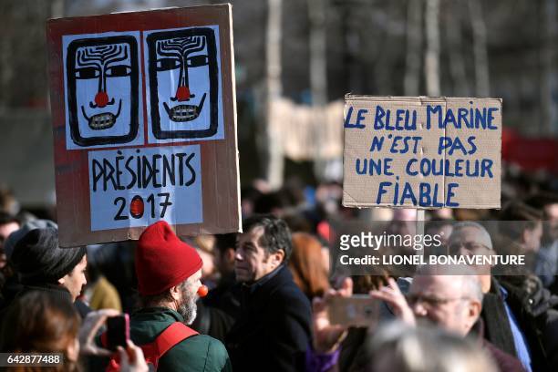 Demonstrator holds a placard reading "The navy blue is not a reliable colour" [the message refers to the far-right Rassemblement Bleu Marine movement...
