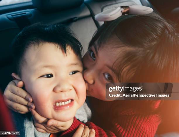Sister Kissing Her Brother in Car
