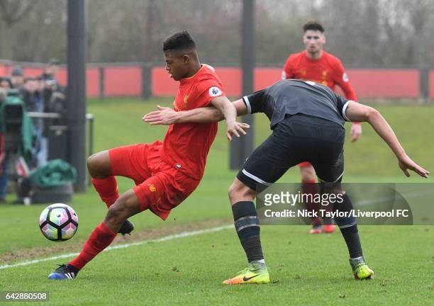 Rhian Brewster of Liverpool holds off a challenge from Sven Karic of Derby County during the Liverpool v Drby County Premier League 2 game at The...