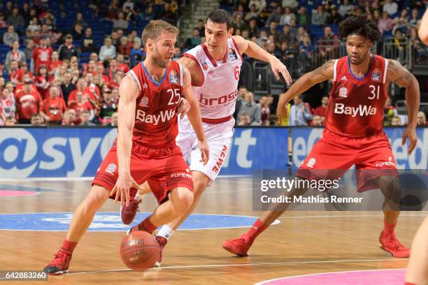 Anton Gavel, Nikolaos Zisis of Brose Bamberg and Davin Booker of FC Bayern Muenchen during the game between Bayern Muenchen and Brose Bamberg on...