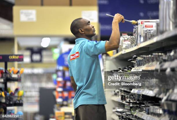 An employee restocks shelves inside a Nakumatt Holdings Ltd. Supermarket in Nairobi, Kenya, on Saturday, Feb. 18, 2017. Nakumatt is Kenya's biggest...