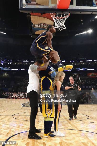 Glenn Robinson III of the Indiana Pacers competes in the 2017 Verizon Slam Dunk Contest with Paul George of the Indiana Pacers at Smoothie King...