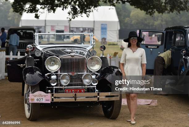 Lady posing with vintage car during the 7th edition of 21 Gun Salute International Vintage Car Rally at India Gate, on February 19 in New Delhi,...