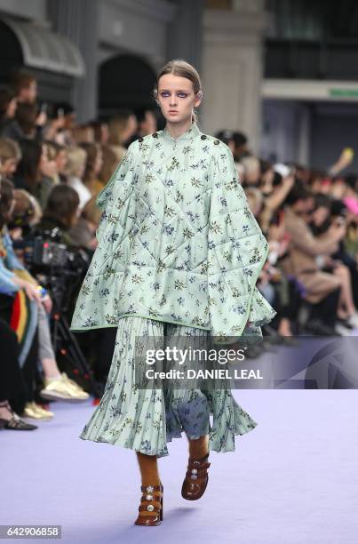 Models present creations by Mulberry during their catwalk show on the third day of the Autumn/Winter 2017 London Fashion Week at the Old Billingsgate...