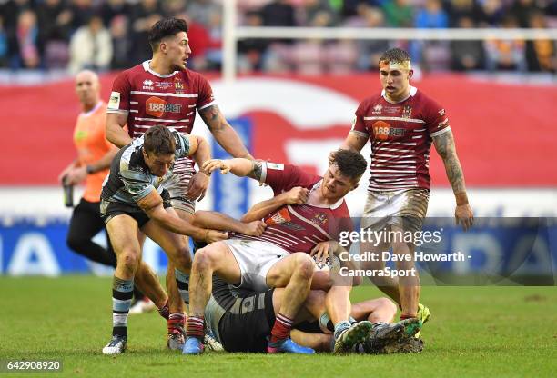 Wigan Warriors' John Bateman is taken over during the Dacia World Club Challenge match between Wigan Warriors v Cronulla-Sutherland Sharks at DW...