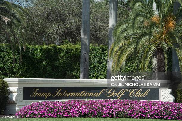 View of the entrance of the Trump International Golf Club in West Palm Beach, Florida, on February 19, 2017. / AFP / NICHOLAS KAMM