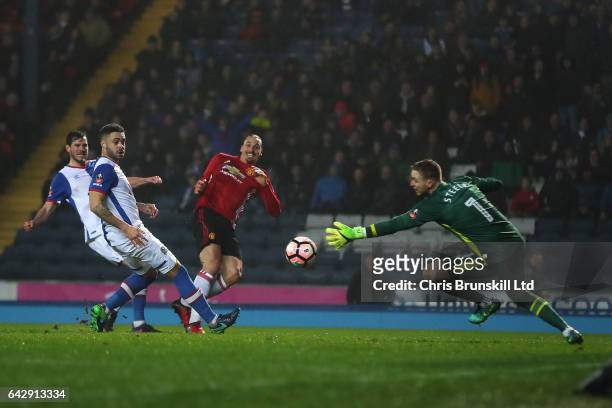 Zlatan Ibrahimovic of Manchester United scores his side's second goal during the Emirates FA Cup Fifth Round match between Blackburn Rovers and...