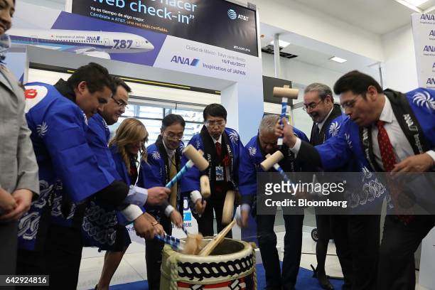 Akira Yamada, Japan's ambassador to Mexico, center, and Hideshi Oshimo, general manager of Mexico operations for All Nippon Airways Co. , center...