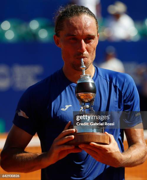 Alexandr Dolgopolov of Ukraine kisses the trophy after wining the final match between Kei Nishikori of Japan and Alexandr Dolgopolov of Ukraine as...