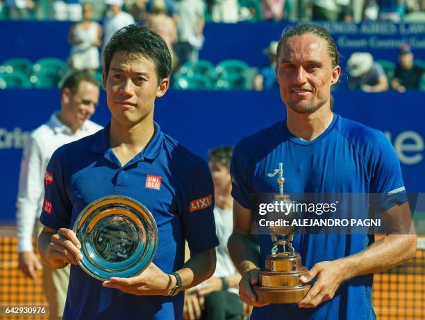 Ukraine's tennis player Alexandr Dolgopolov and runner up Japan's Kei Nishikori pose with their respective trophies after the final of the Argentina...