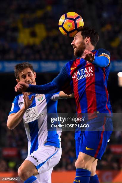 Barcelona's Argentinian forward Lionel Messi vies with Leganes' Argentinian midfielder Alexander Szymanowski during the Spanish league football match...