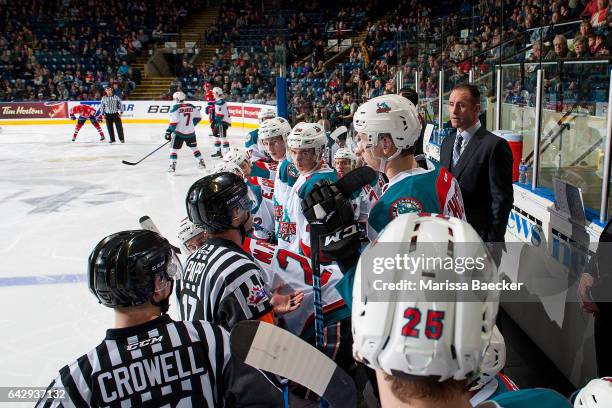 Kelowna Rockets' head coach Jason Smith stands on the bench and speaks to referee Steve Papp against the Spokane Chiefs on February 17, 2017 at...