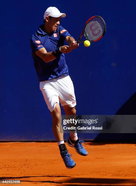 Kei Nishikori of Japan takes a backhand shot during a final match between Kei Nishikori of Japan and Alexandr Dolgopolov of Ukraine as part of ATP...