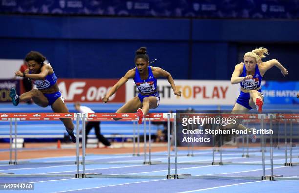 Sharika Nelvis of the United States, Christina Manning of the United States and Sally Pearson of Australia compete in the Women?s 60m hurdles final...