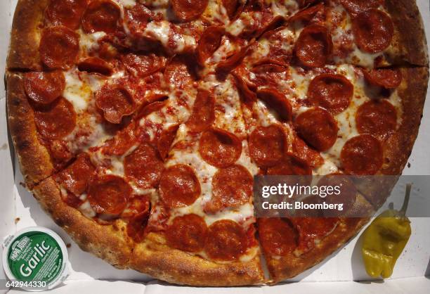 Papa John's International Inc. Pepperoni pizza pie sits arranged for a photograph in Shelbyville, Kentucky, U.S., on Friday, Feb. 10, 2017. Papa...