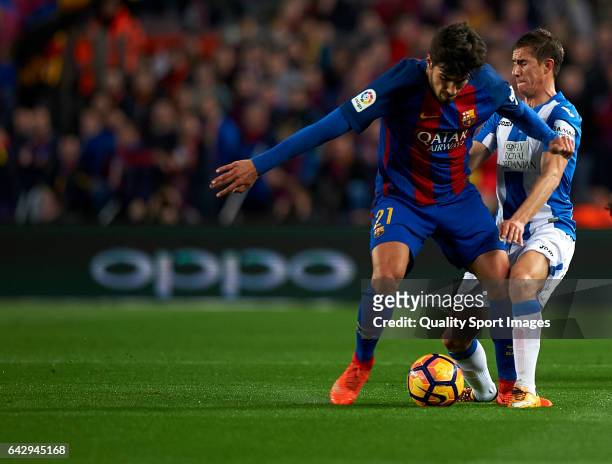 Andre Gomes of Barcelona competes for the ball with Alexander Szymanowski of Leganes during the La Liga match between FC Barcelona and CD Leganes at...